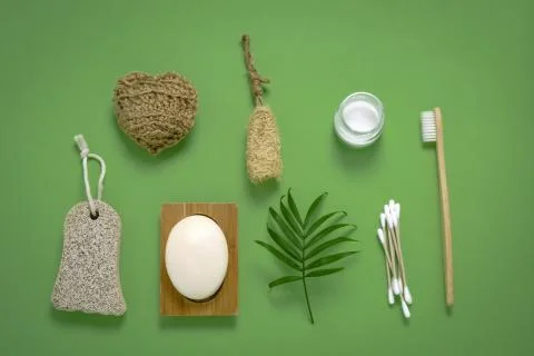 Top view flat lay eco friendly bathroom kit: bamboo toothbrush,ear sticks, wa Stock Photos