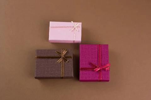 Top view flat lay gift boxes on a brown background Stock Photos