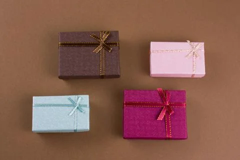 Top view flat lay gift boxes on a brown background Stock Photos