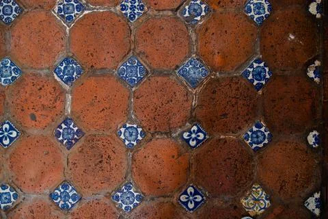 Top view flat lay of historic hexagonal terracotta bricks and decorative Talaver Stock Photos