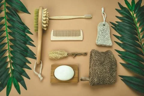 Top view flat lay jute washcloth, loofah face sponge, bamboo tooth brush, nat Stock Photos