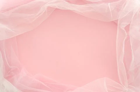 Top view. Flat lay minimal concept. Frame made of duotone tulle on pink Stock Photos