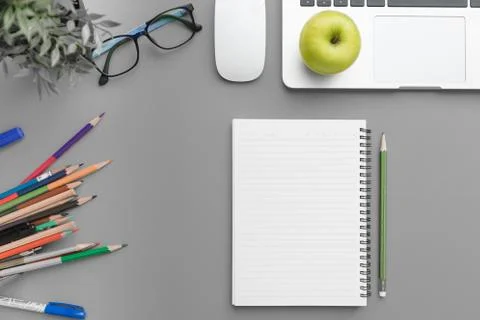Top view, flat lay of Modern gray office desk table with laptop Stock Photos