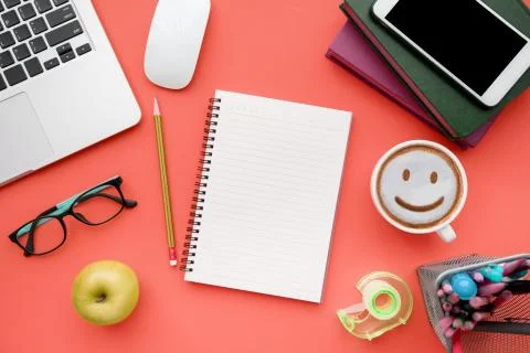 Top view, flat lay of Modern red office desk table with laptop Stock Photos