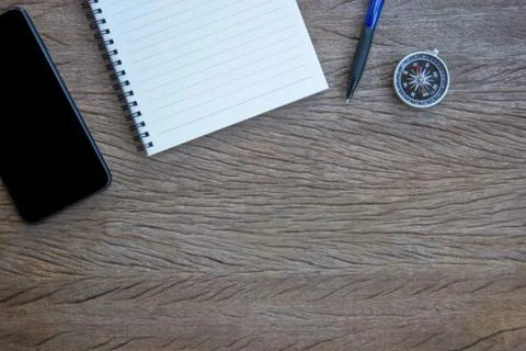 Top view, flat lay office supply ( Smartphone, note book, pen and compass on  Stock Photos
