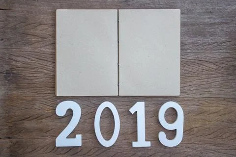 Top view, flat lay with open empty note book on wood table. Stock Photos