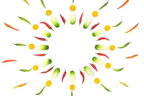 Top view flat lay over cucumbers, cherry tomatoes and peppers on a white back Stock Photos