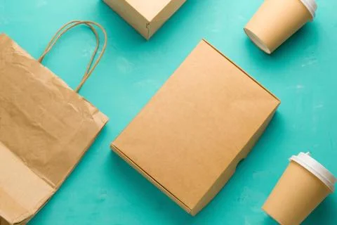 Top view flat lay recyclable types of paper  packaging on a blue background,  Stock Photos