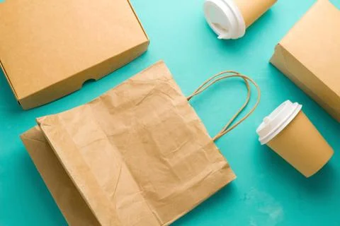 Top view flat lay recyclable types of paper  packaging on a blue background,  Stock Photos