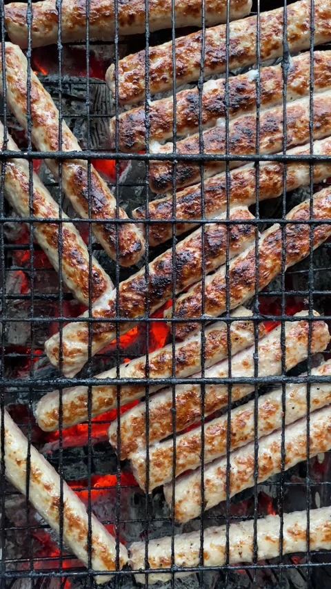 Top view, flat lay sausages sizzling on grill 動画素材 308280538