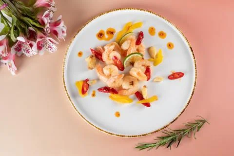 Top view flat lay of sautéed garlic shrimps with chili and bell peppers Stock Photos