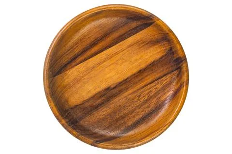 Top view, flat lay of single empty wooden plate. Stock Photos