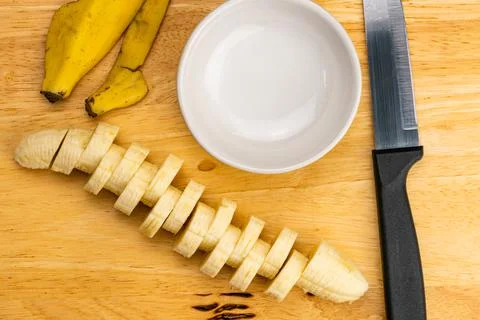Top view, flat lay slice of raw ripe organic peeled banana. Stock Photos