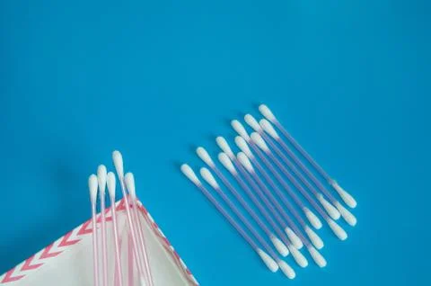 Top view, flat lay, a small group of pink plastic cotton swabs neatly arrange Stock Photos