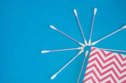 Top view, flat lay, a small group of pink plastic cotton swabs neatly arrange Stock Photos