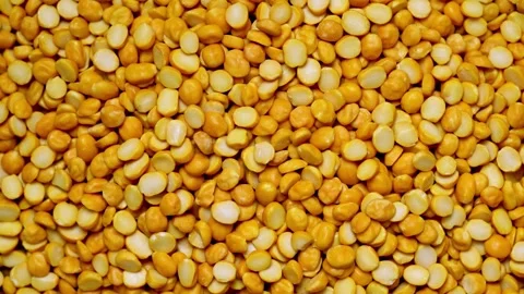 Top view flat lay split bengal gram chana dal food texture footage rotate Stock Footage 262306302
