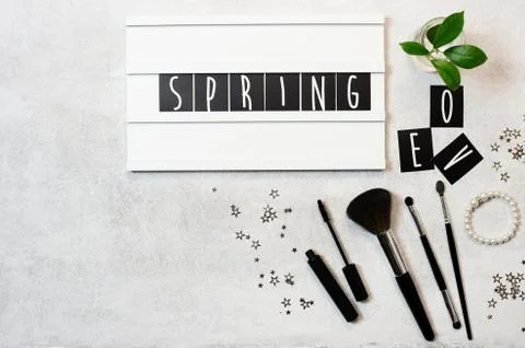 Top view flat lay Spring word on lightbox Stock Photos