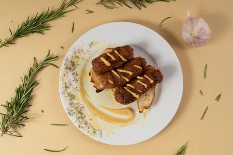 Top view flat lay of traditional Romanian mici sausages with mustard Stock Photos