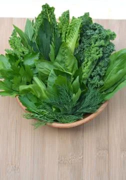 Top view flat layout frame of fresh culinary herbs and green leaf vegetables Stock Photos