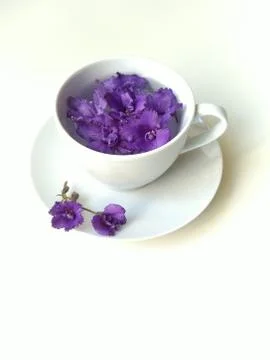 Top view, flat layout, white coffee Cup with purple bells Stock Photos
