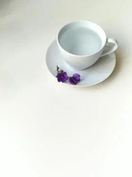 Top view, flat layout, white coffee Cup with purple bells Stock Photos
