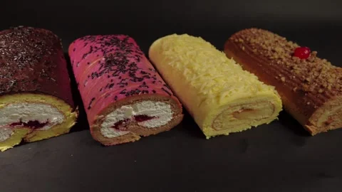 Top view flat shot of slider shot of cake rolls brazo gitano swiss roll Vídeos de archivo 270672264