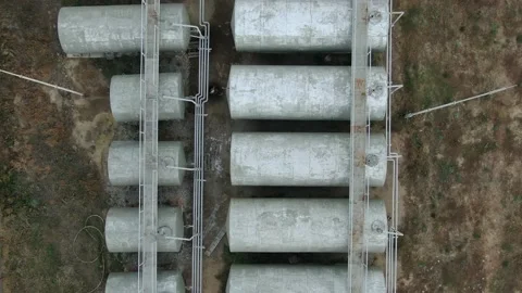 Top view, flight over fuel storage, small farm Stock Footage 158226119