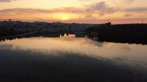 Top view of flight over lake at sunset. Landscape, reflection in the water. Stock Footage 127019777
