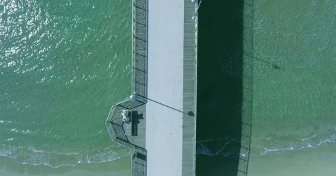 Top view of a flight over a pier with tourists on a summer day in good weather Stock Footage 73529107