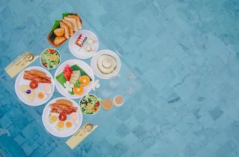 Top view of  floating breakfast set  in swimming pool. Stock Photos