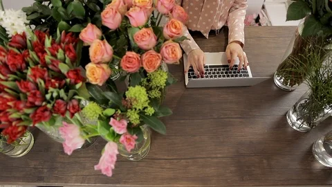 Top View Florist Table With Laptop, Flower Shop Workplace, Laptop. Stock Footage 124521094