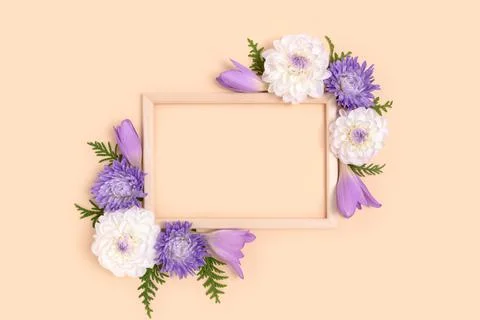 Top view of flower border frame made of dahlia and green leaves Stock Photos