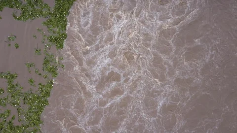Top view of a flowing river after heavy rain and flooding of agricultural land. Stock Footage 251938895