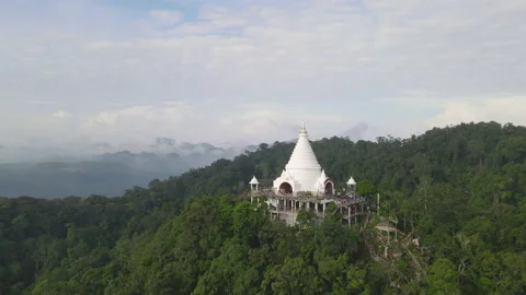Top view of fly over old pagoda on mountain in Thailand with green forest Video stock 142082674