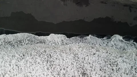 Top view flying drone of amazing nature view Black Sand Beach, Iceland Stock Footage 253723640