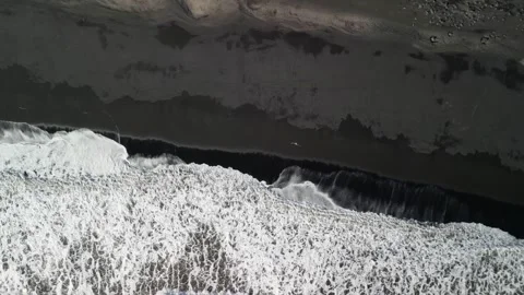 Top view flying drone of amazing nature view Black Sand Beach, Iceland Stock Footage 253723656