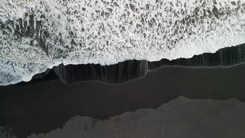 Top view flying drone of amazing nature view Black Sand Beach, Iceland Stock Footage 253723764