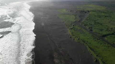 Top view flying drone of amazing nature view Black Sand Beach, Iceland Stock Footage 253787465