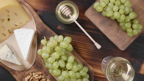 Top view of a food composition with cheese and wine Stock-Footage 105366636