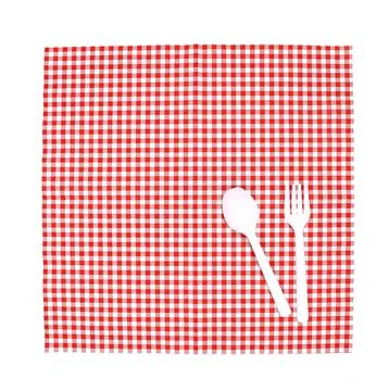 Top view fork and spoon on tablecloth for food serving background Stock Photos