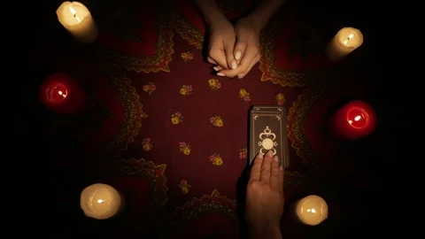 Top view, fortune teller places a deck of tarot cards on the table, female Stock Footage 247981687