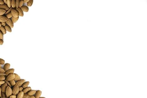 Top view of framed pile of almonds on  isolate white background.For vearians. Stock Photos
