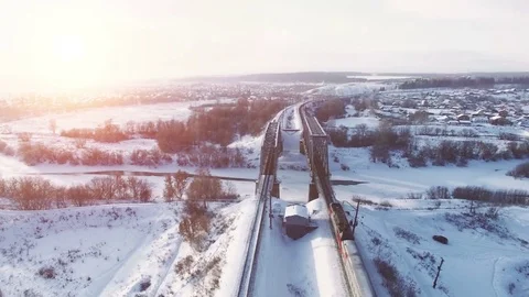 Top view of freight train with carriages on railways at winter Video stock 70716228
