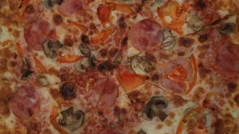 Top view of fresh baked pizza with tomatoes,salami and cheese mozzarella Video stock 148952908