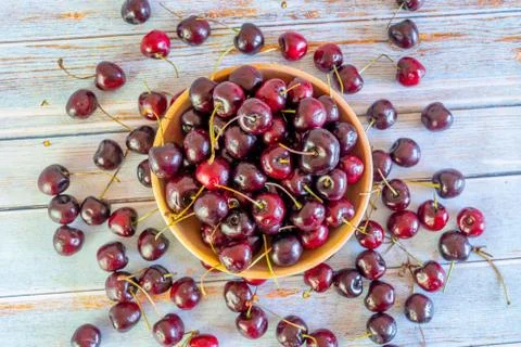 Top view of fresh cherries in rustic bowl Stock Photos