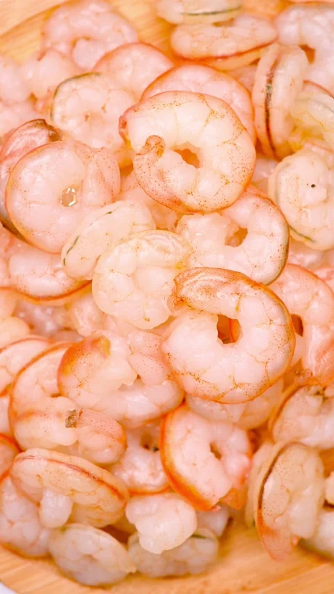 Top view fresh cooked unskin shrimps rotating vertical composition 스톡 동영상 237570819