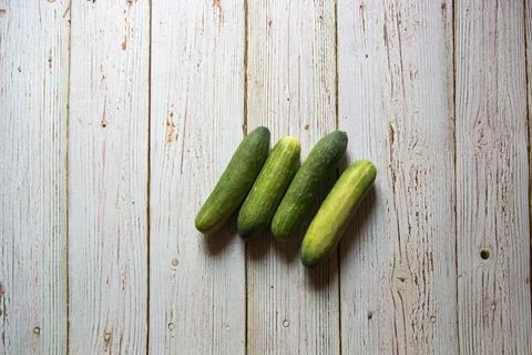 Top view of fresh cucumbers on a background Stock Photos