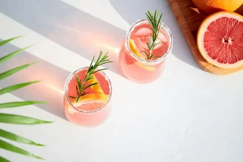 Top view of fresh grapefruit or red orange cocktails, with ice cubes, fresh Stock Photos