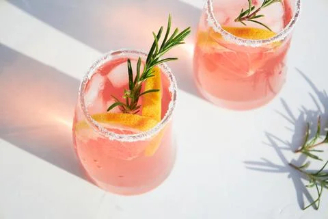 Top view of fresh grapefruit or red orange cocktails, with ice cubes, fresh Stock Photos