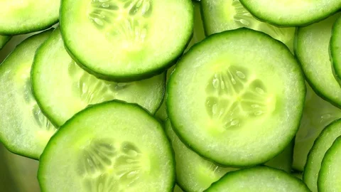 Top view of fresh sliced cucumber rotation Stock Footage 128495312